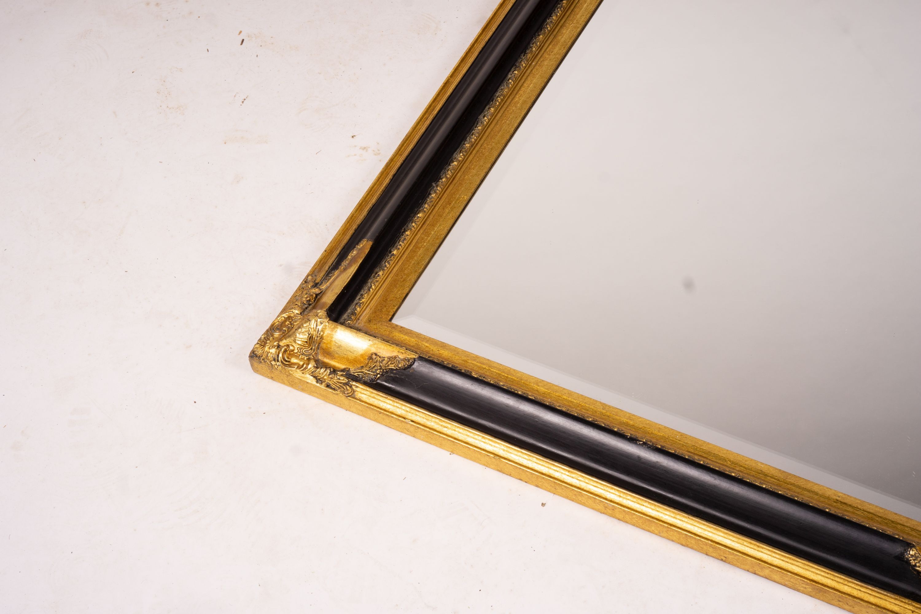 A 19th century French gilt gesso wall mirror, width 64cm, height 116cm together with a modern larger rectangular wall mirror